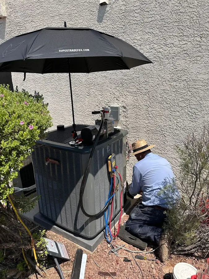 HVAC technician performing outdoor AC maintenance in Glendora